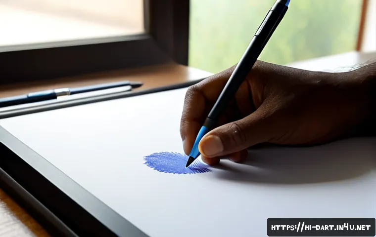 Home 17 디지털아트에서의 필압 조절법 - Photorealistic close-up of an Indian digital artist’s hand using a stylus on a pen display, one side...